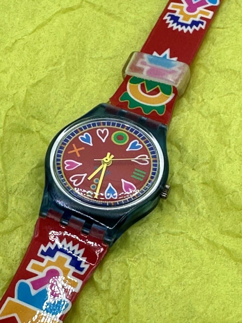 Swatch Red Dial Watch with Multicolor Heart and Geometric Accents